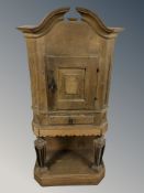 A 19th century oak single door cabinet on stand,
