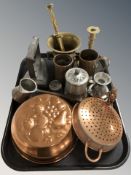 Metal wares including a brass mortar and pestle, copper kitchenalia, iron, candlestick, etc.