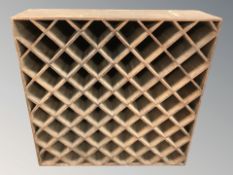 An early 20th century bottle rack/shelf,