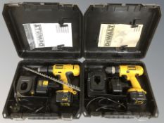 Two DeWalt power drills in cases with accessories.
