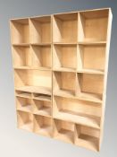 A group of Scandinavian modular plywood open shelves,