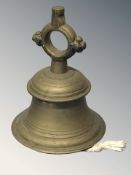 A brass ship's bell with clapper, height 20.5 cm.