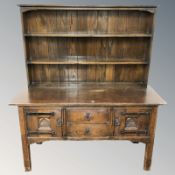 A 20th century oak dresser, 153 cm x 52 cm x 170 cm.