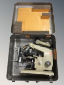 A continental microscope in aluminium travel case.
