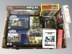 A collection of tabletop gaming miniatures including Roman soldiers, vikings,