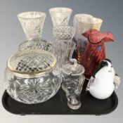 A group of crystal vases, rose bowls, a Dartington cranberry glass vase,