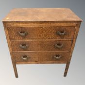 An Edwardian oak three drawer chest,