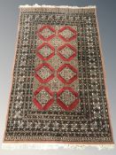 A Lahore Bokhara rug, Pakistan, 213 cm x 127 cm.