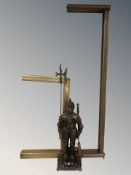 A metal knight fire companion set, a brass fire curb, a copper curb and a brass framed mirror.