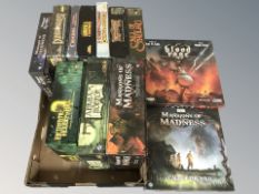 A collection of tabletop games including Arkham Horror, Mansions of Madness, Dungeon Quest, etc.