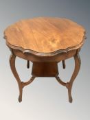 A late Victorian walnut occasional table, diameter 75 cm.