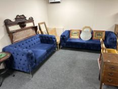 A contemporary Chesterfield four seater settee in buttoned blue fabric,