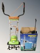 A rotavator and a boxed sprayer.