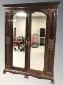 A late Victorian mahogany mirrored double door wardrobe, 164 cm W x 59 cm D x 109 cm H.