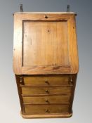 A pine fall front multi drawer chest, width 36 cm.