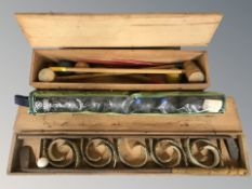 A Triang croquet set in pine box, a further croquet set and a set of lawn bowls.