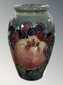 A small Moorcroft pomegranate vase, height 10.5 cm.