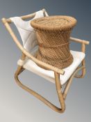 A bentwood armchair and a wicker stool