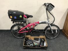 A Liberté Swifty 20 folding electric bike, with rear pannier, related accessories, spare saddle,