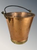 A copper bucket with swing handle, overall height 45 cm.