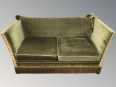 An early 20th century two seater continental settee in green fabric,
