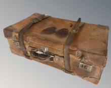 An early 20th century stitched brown leather luggage case,