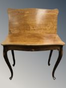 A 19th century continental mahogany turnover top tea table, width 91 cm.