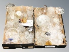 A large quantity of crystal and pressed glass items including drinking glasses, decanters, bowls,