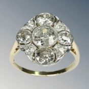An Art Deco 18ct gold diamond cluster ring, the old-cut stones weighing an estimated 1.