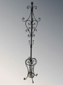A reproduction wrought metal hat and coat stand, height 199 cm.