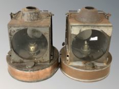 A pair of copper plated signalling oil lamps, height 25 cm including handle.