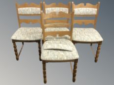 Four blond oak dining chairs
