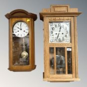 An early 20th century continental oak eight day wall clock with silvered dial, with pendulum,