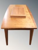 A Scandinavian extending dining table with two leaves,
