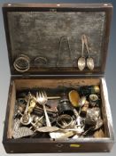 A Victorian rosewood jewellery box containing silver napkin rings, tea spoons, pair of sugar tongs,