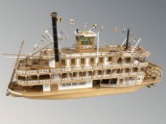 A scale model of a paddle steamer, length 110 cm.