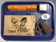 A brass door knocker in the form of a masonic compass and square, an Adapter tin plate school case,