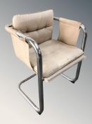 A Scandinavian chrome framed armchair
