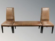 A pair of Stone International crocodile-pattern high backed chairs and a matching bench,