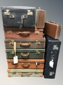 A collection of vintage luggage cases, largest 77 cm wide.