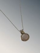 A 9ct white gold synthetic opal pendant on 9ct white gold chain