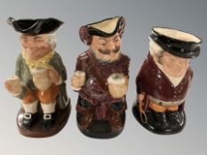 Three Royal Doulton toby jugs 'The Huntsman', 'Falstaff', and 'Happy John', height 22 cm.