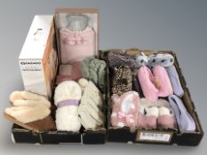 Two crates of slippers and un-used footwear,