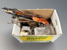 A box of violin bows, musical instrument parts,