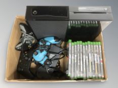 An Xbox-1 console together with controllers and various games