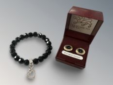 A pair of 9ct gold and black onyx earrings,