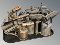 A group of antique and later brass blow torches.