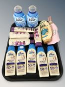 Five bottles of Soltan children's sun care lotion, five bottles of conditioner,