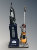 A Sebo vacuum cleaner and a Dyson DC24 vacuum