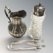 A crystal sugar sifter with silver mount,